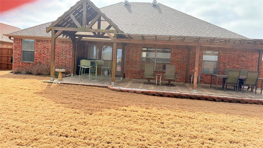 312 McAfee Street Mabank, TX 75147 - Photo 7 of 40 a view of a house with a patio