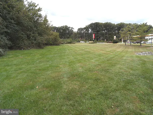a view of a swimming pool with a yard