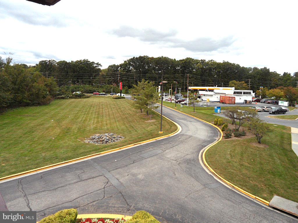 12513 Laurel Bowie Road Laurel, MD 20708 - Photo 15 of 22 a view of a swimming pool with a yard