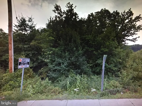 a view of a patio with a table and chairs