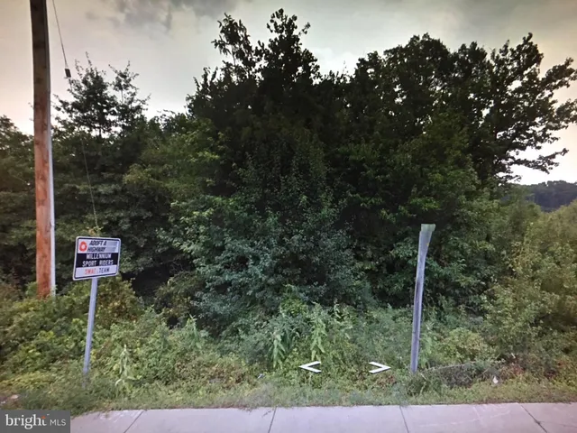 a view of a patio with a table and chairs