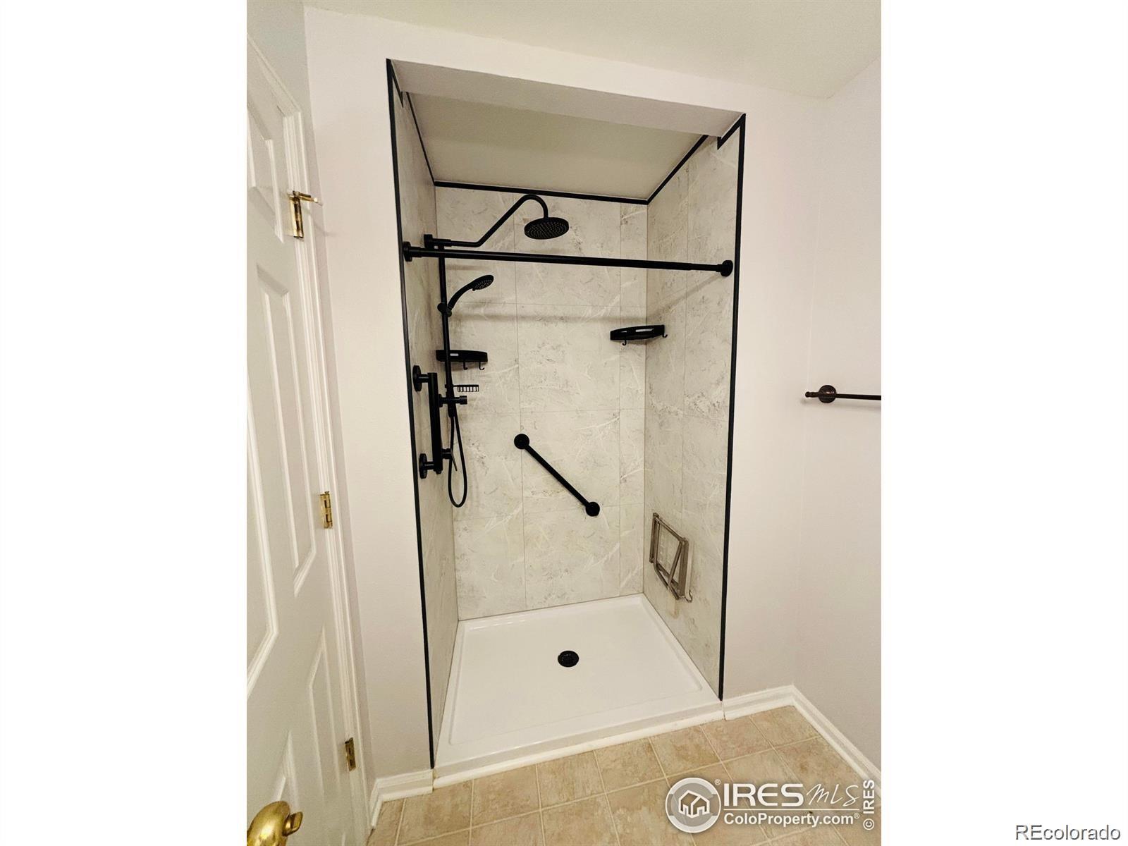 2338 Jeanette Way Colorado Springs, CO 80951 - Photo 11 of 18 a bathroom with a shower