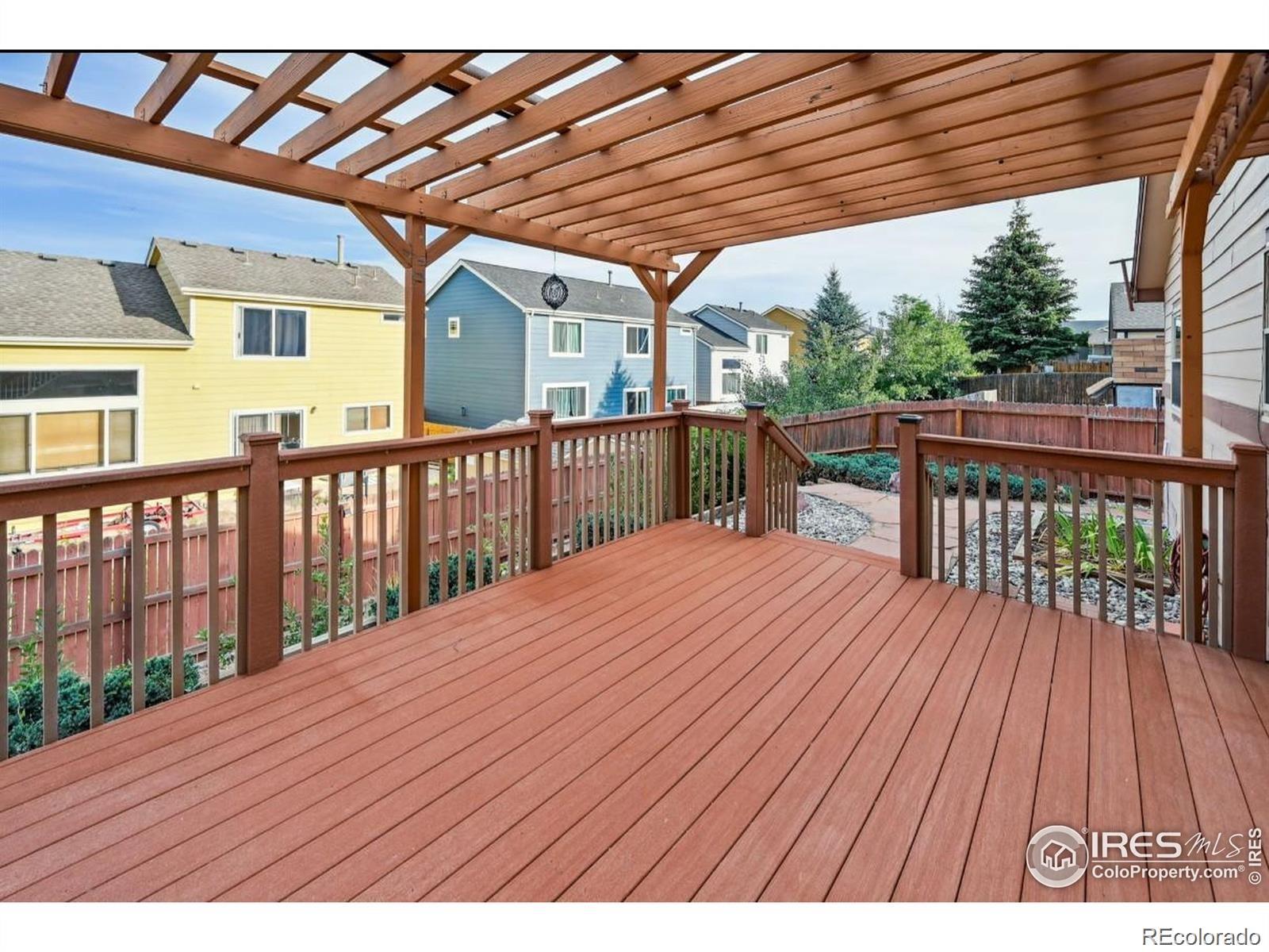 2338 Jeanette Way Colorado Springs, CO 80951 - Photo 12 of 18 a view of backyard with a deck and wooden floor