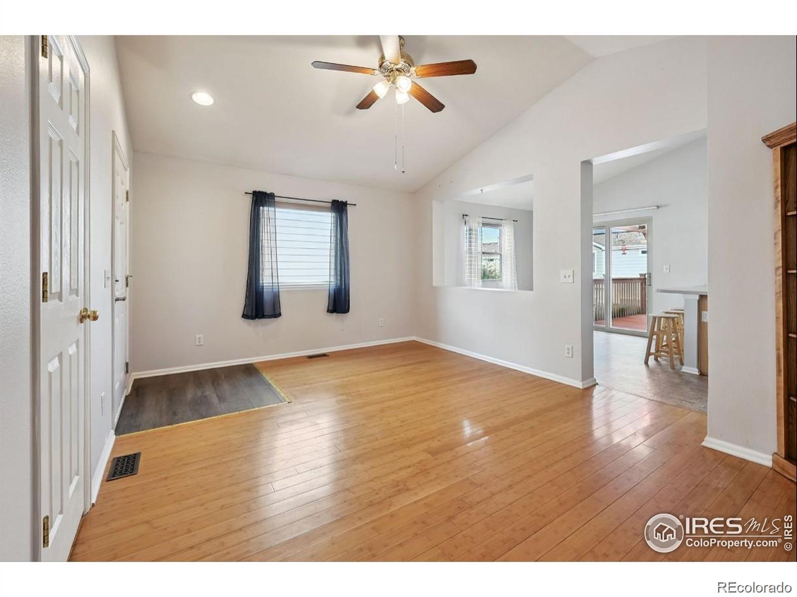 2338 Jeanette Way Colorado Springs, CO 80951 - Photo 3 of 18 a view interior of a house wooden floor and a chandelier fan