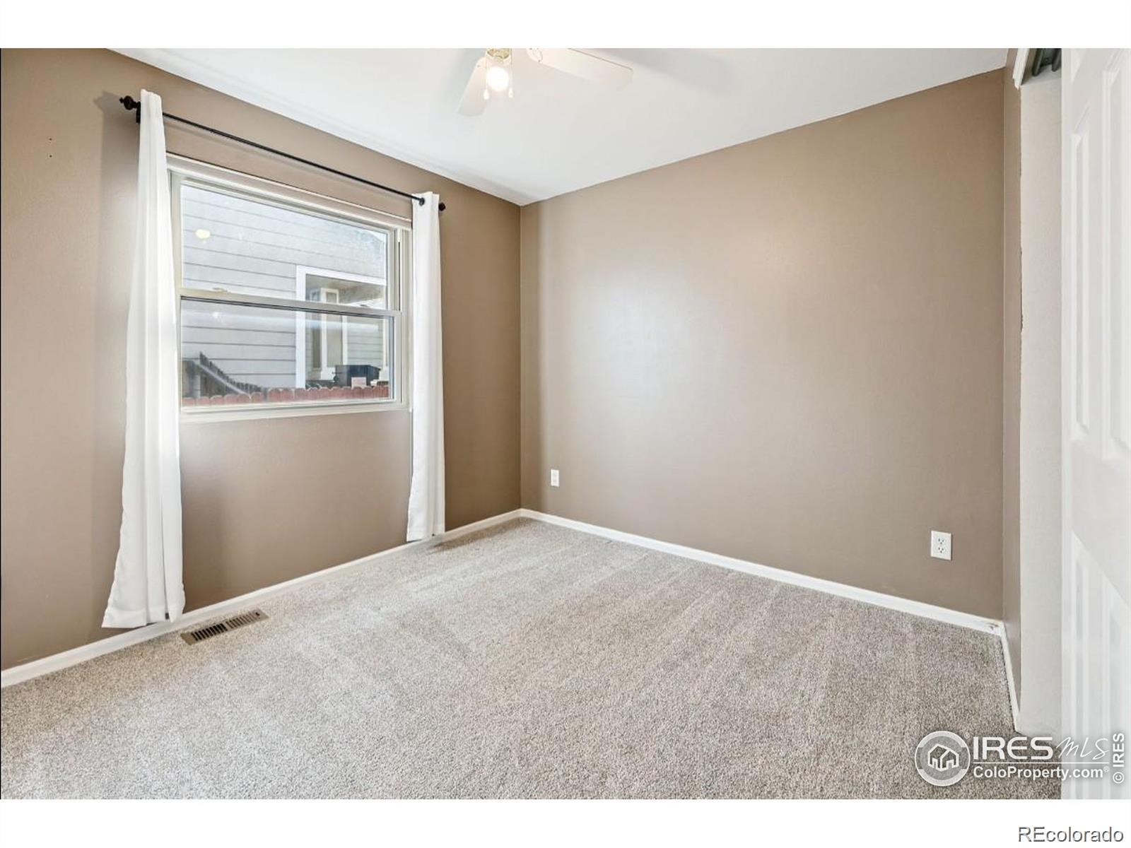 2338 Jeanette Way Colorado Springs, CO 80951 - Photo 8 of 18 a view of an empty room with closet and a window