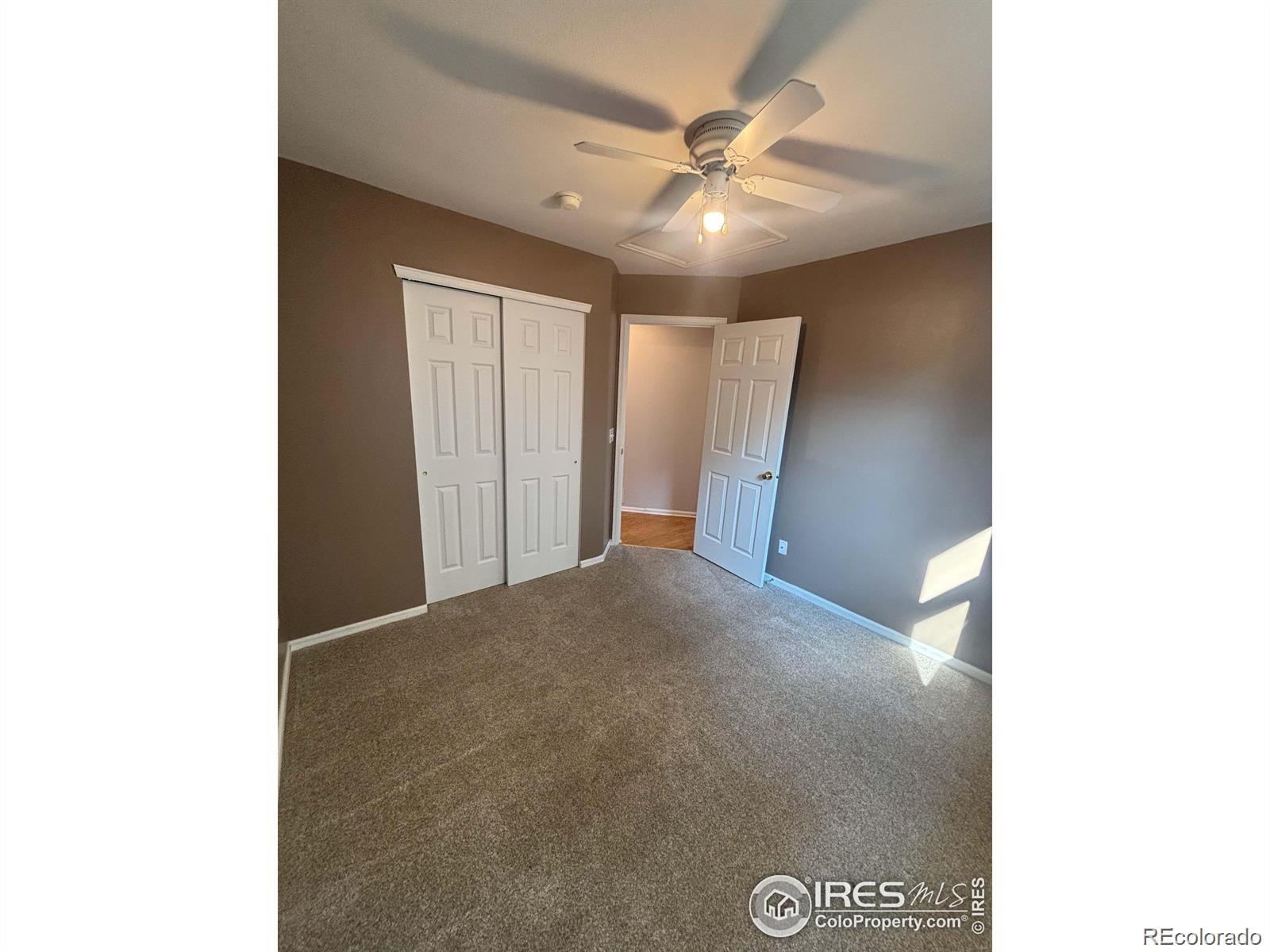 2338 Jeanette Way Colorado Springs, CO 80951 - Photo 9 of 18 a view of a hallway with a ceiling fan