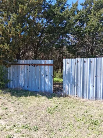 a view of outdoor space and wooden fence