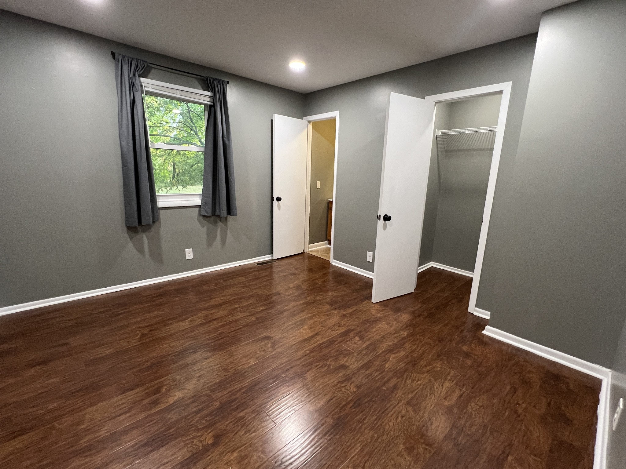 3019 Friendship Road Cross Plains, TN 37049 - Photo 16 of 39 an empty room with wooden floor and windows