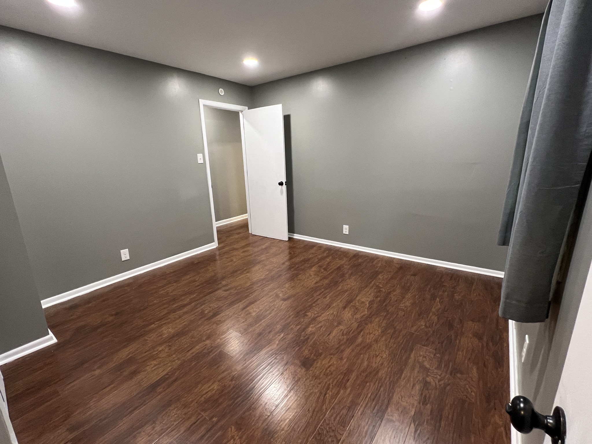 3019 Friendship Road Cross Plains, TN 37049 - Photo 17 of 39 an empty room with wooden floor and entrance