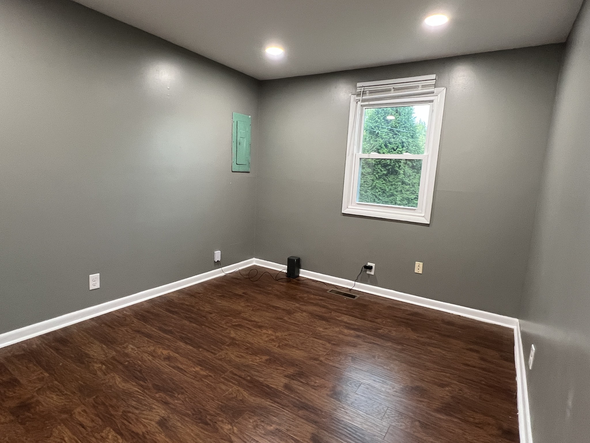 3019 Friendship Road Cross Plains, TN 37049 - Photo 20 of 39 a view of an empty room with wooden floor and a window