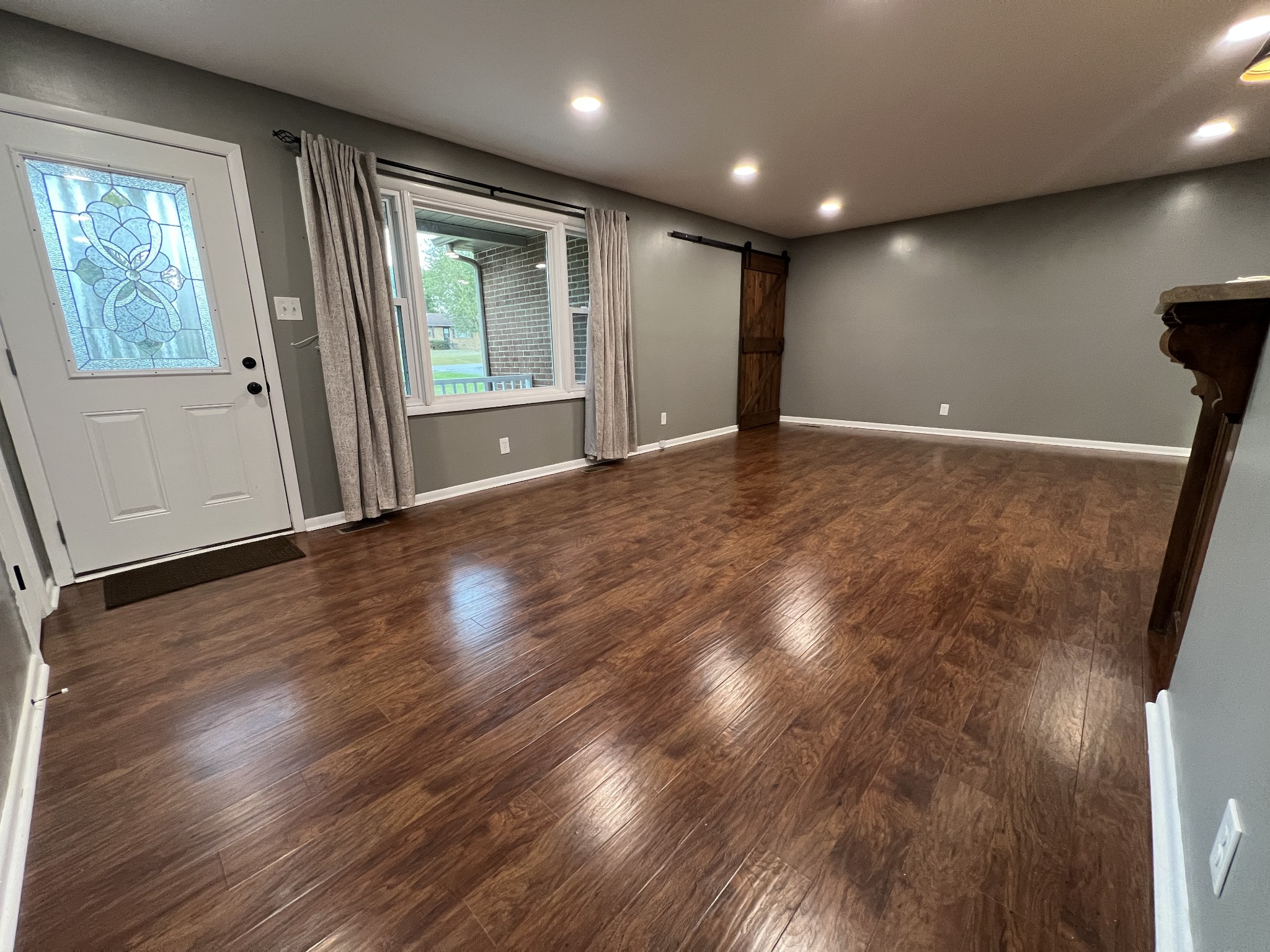 3019 Friendship Road Cross Plains, TN 37049 - Photo 2 of 39 an empty room with wooden floor and windows