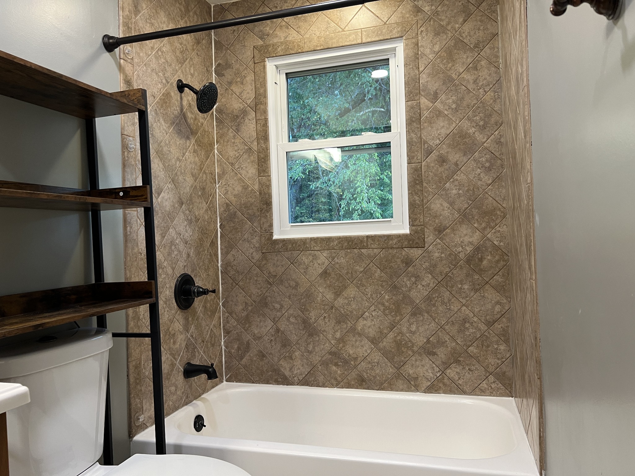 3019 Friendship Road Cross Plains, TN 37049 - Photo 22 of 39 a bathroom with a bathtub and a shower