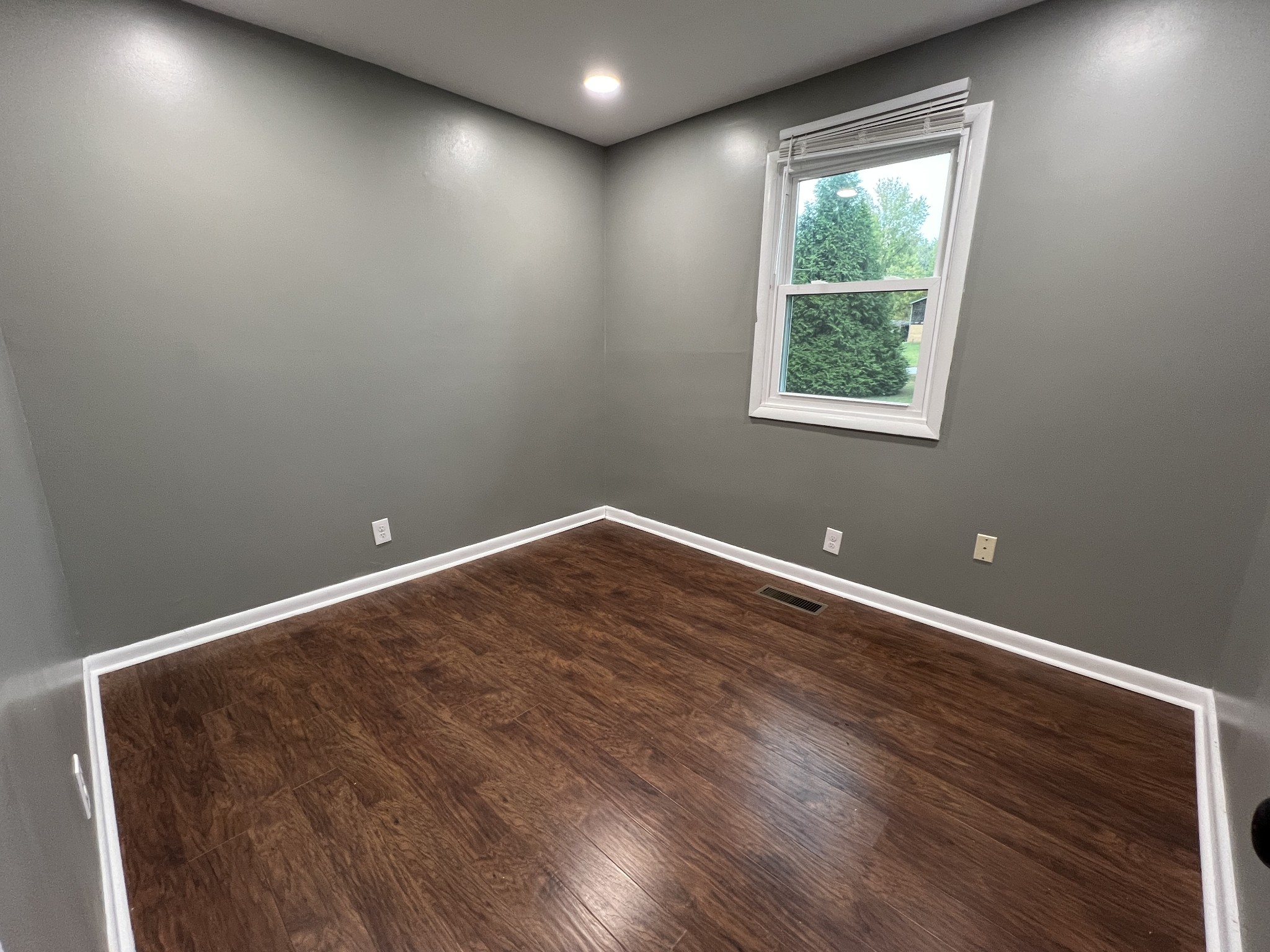 3019 Friendship Road Cross Plains, TN 37049 - Photo 24 of 39 an empty room with wooden floor and windows