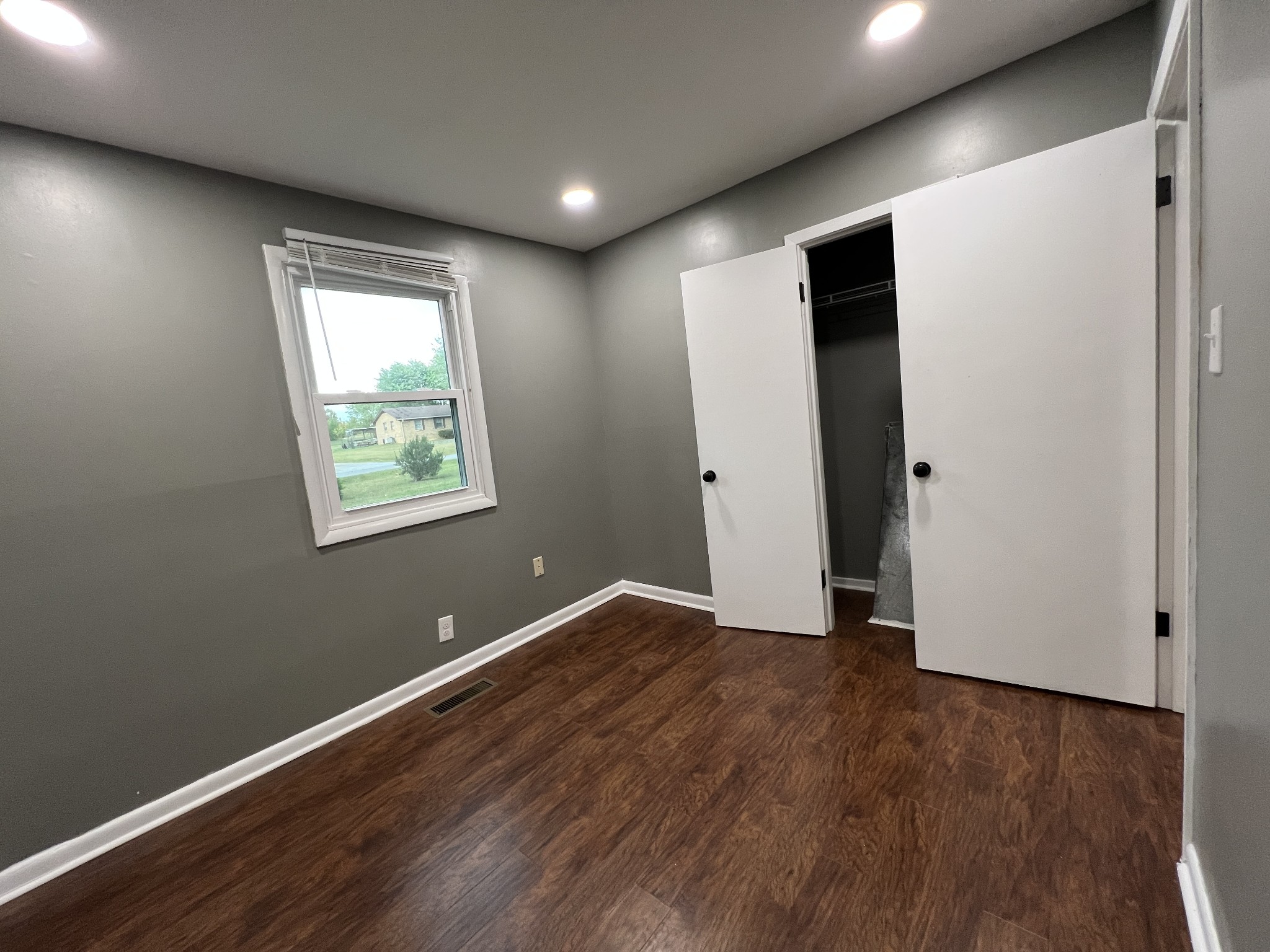 3019 Friendship Road Cross Plains, TN 37049 - Photo 25 of 39 an empty room with wooden floor and windows
