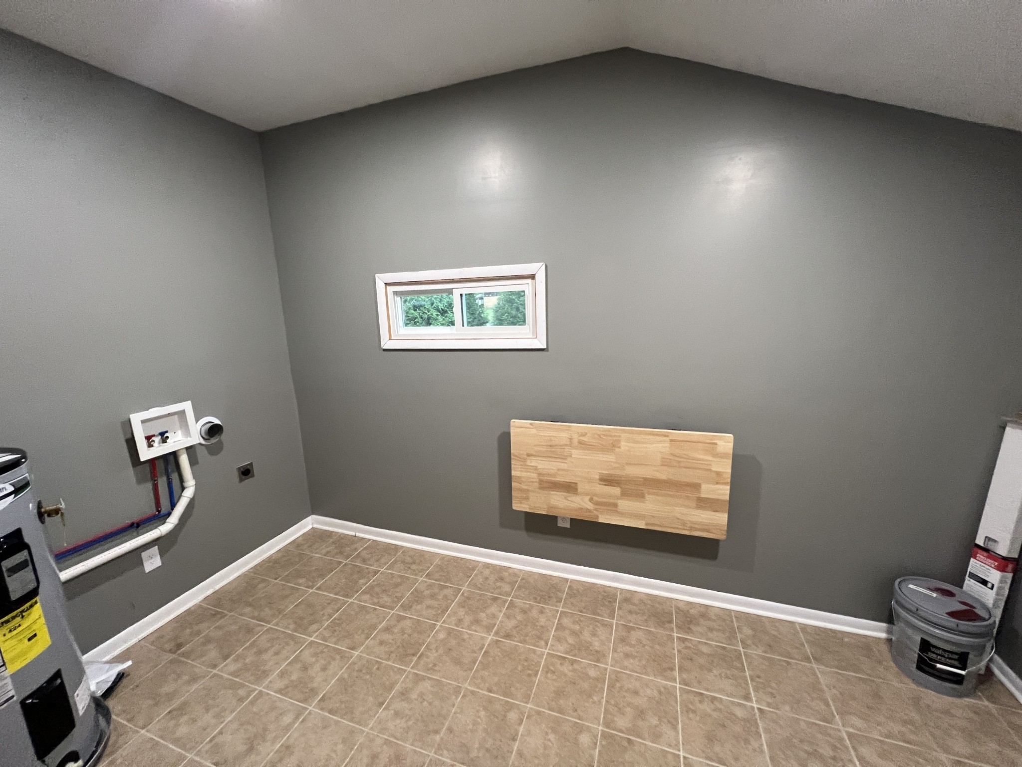 3019 Friendship Road Cross Plains, TN 37049 - Photo 6 of 39 a room with painting on the wall and a table