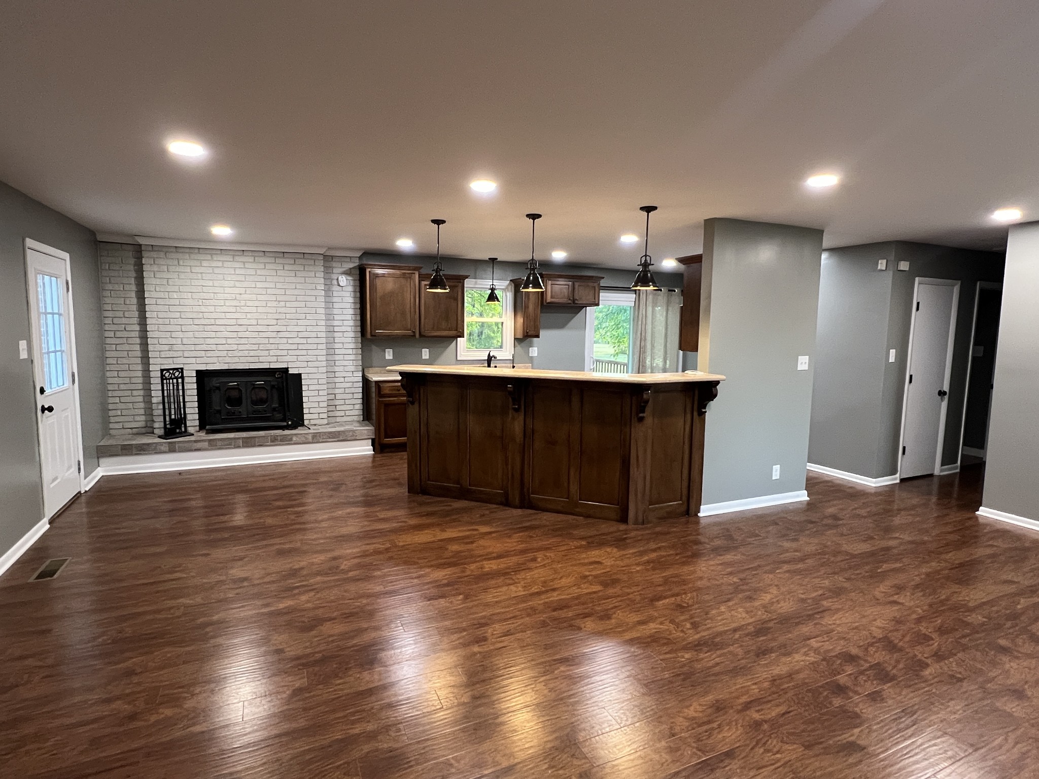 3019 Friendship Road Cross Plains, TN 37049 - Photo 7 of 39 an empty room with wooden floor and fireplace