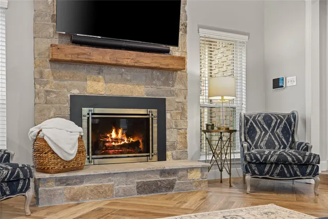 a living room with furniture a fireplace and a fireplace