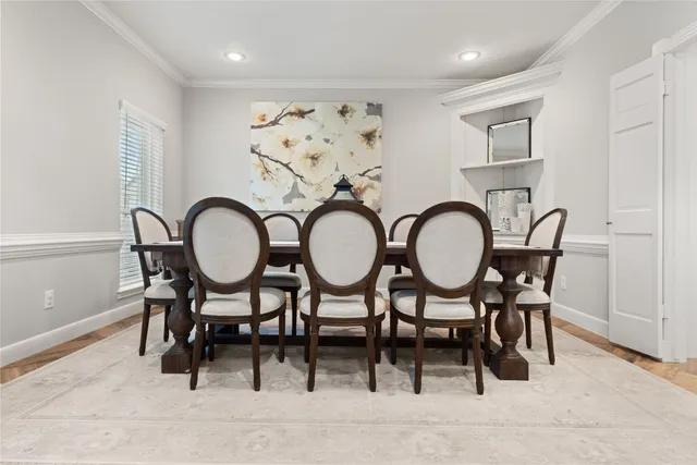 a view of a dining room with furniture and front view