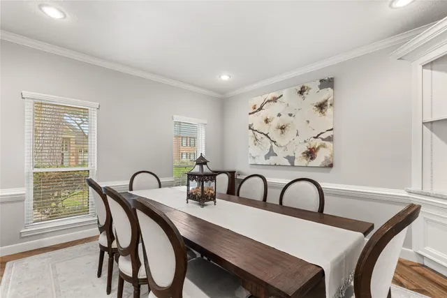 a view of a dining room with furniture and window