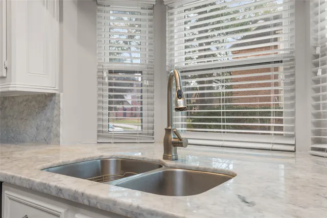 a kitchen with a sink and a window