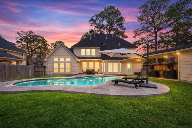 a view of a house with a yard porch and sitting area