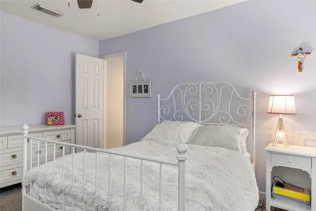 a bedroom with a bed and a cabinets