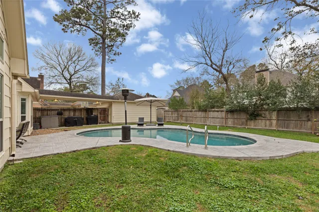 a view of a backyard with a small pool