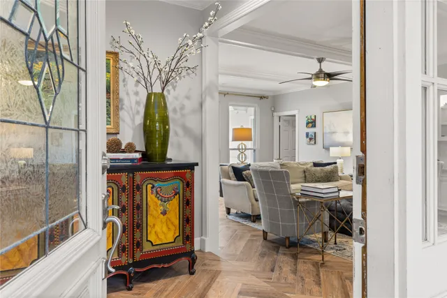 a view of a workspace with furniture and a window