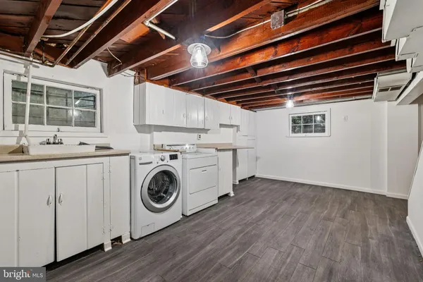 a utility room with dryer and washer