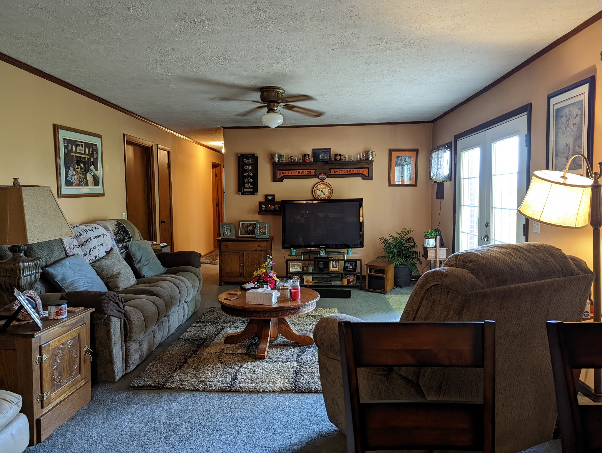 6765 Highland Road Portland, TN 37148 - Photo 12 of 31 a living room with furniture a large window and a flat screen tv