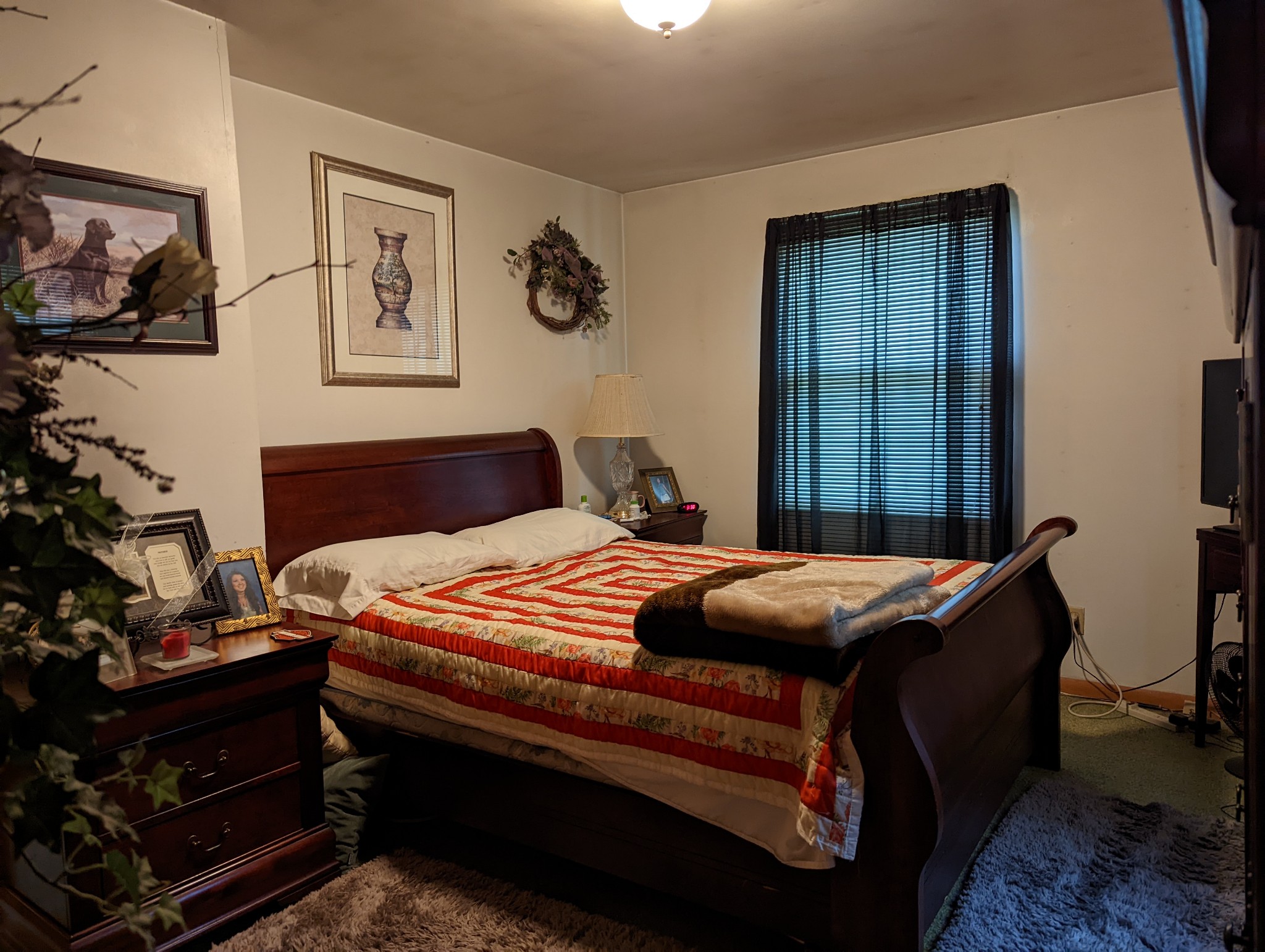 6765 Highland Road Portland, TN 37148 - Photo 15 of 31 a bedroom with bed and paintings on the wall