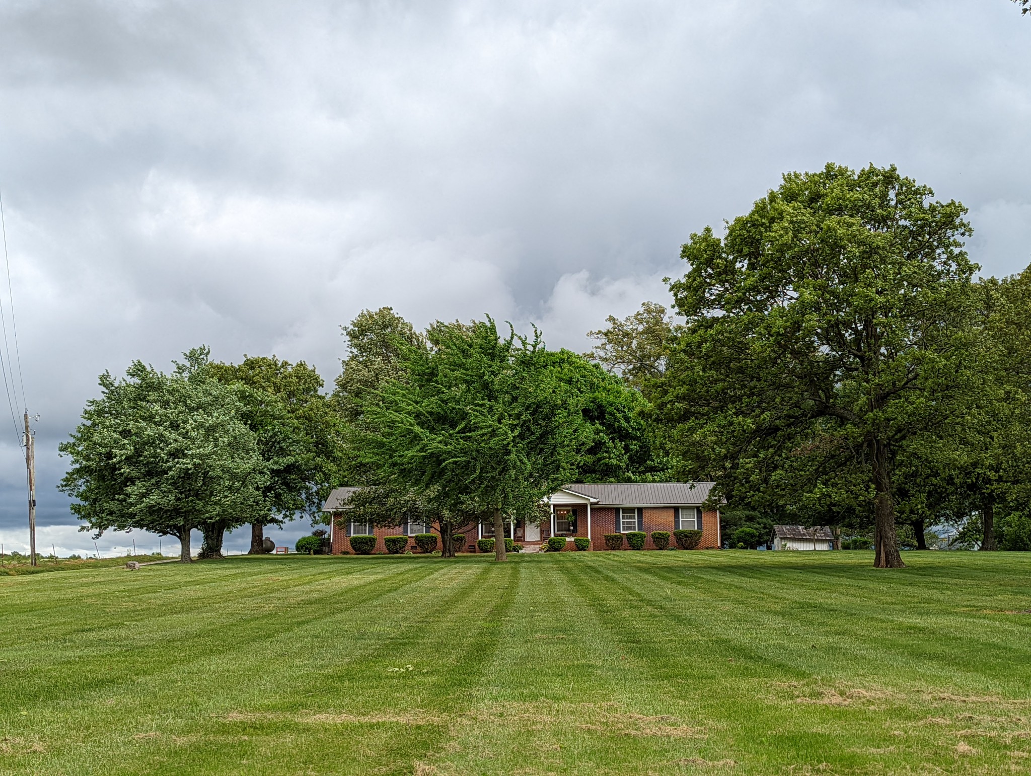 6765 Highland Road Portland, TN 37148 - Photo 23 of 31 a front view of a house with a garden