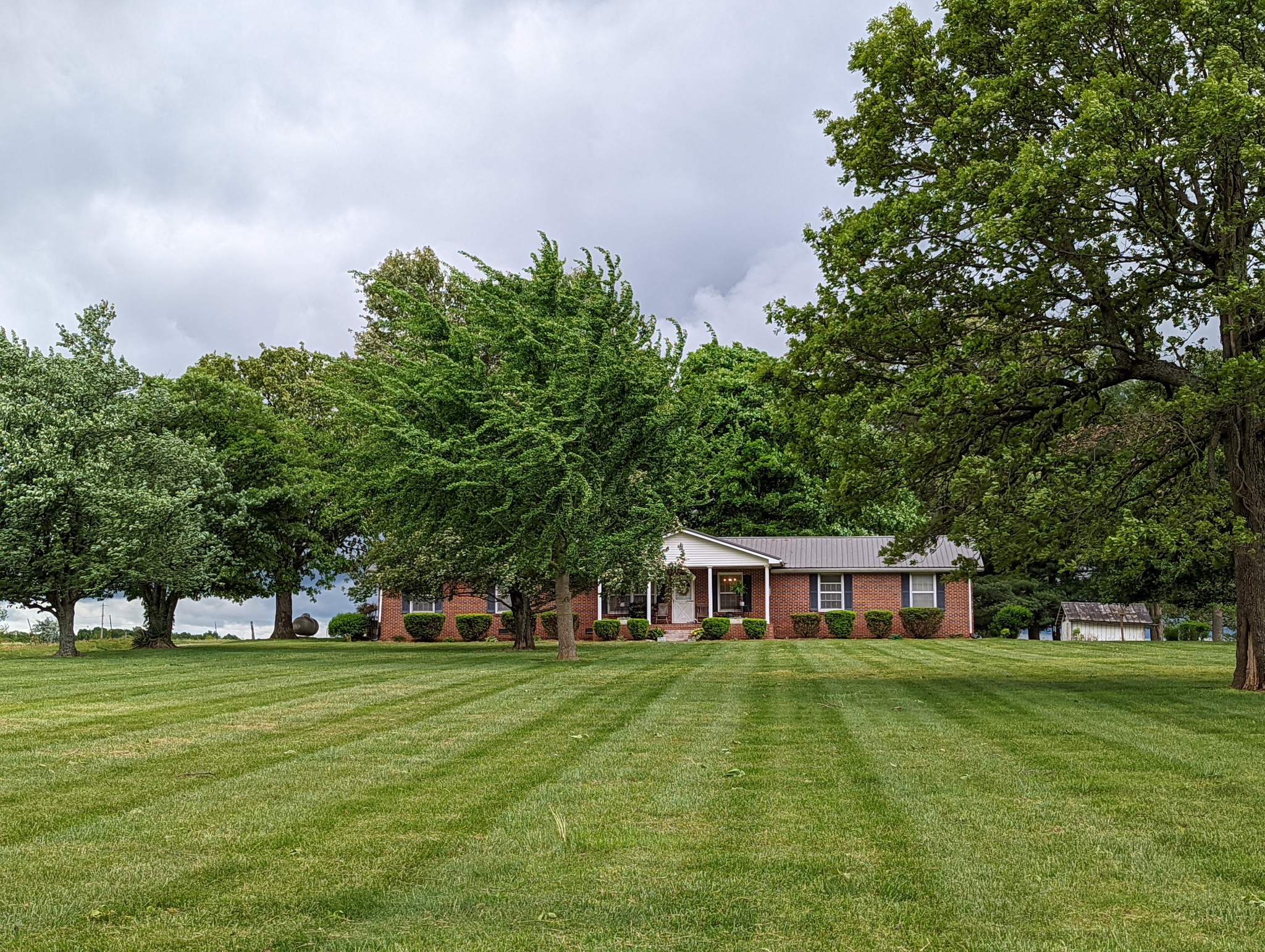 6765 Highland Road Portland, TN 37148 - Photo 31 of 31 a front view of a house with a garden