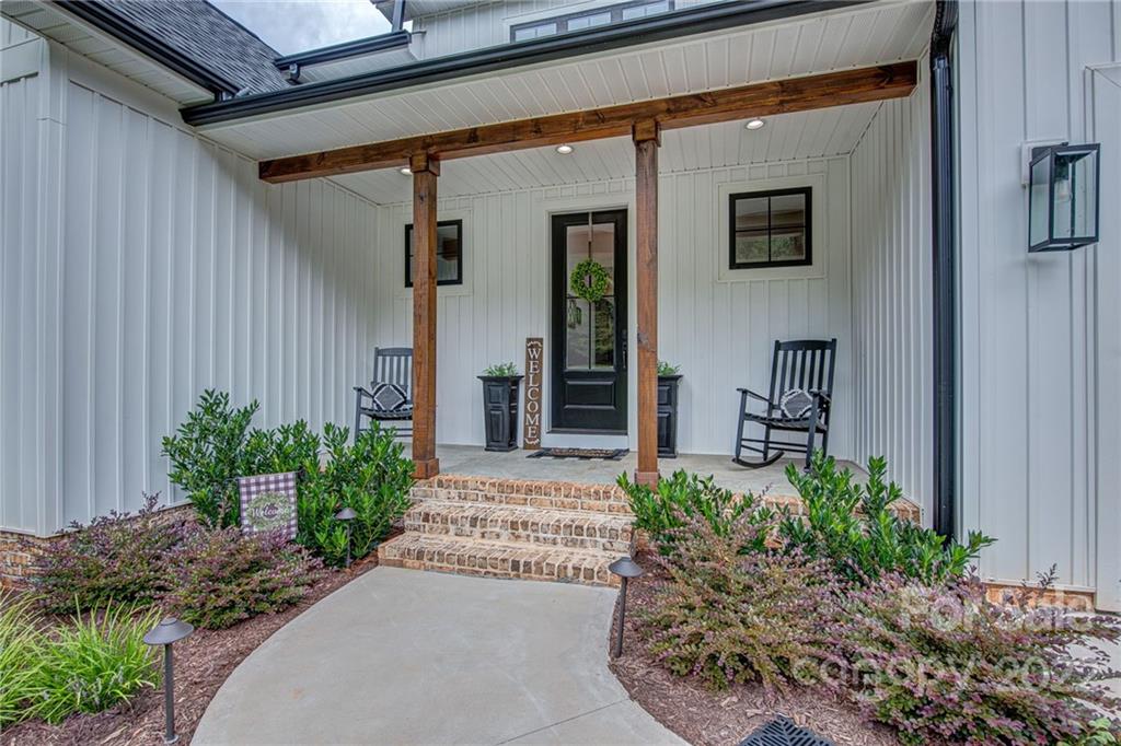 1388 Lawrence Road Clover, SC 29710 - Photo 5 of 48 a front view of a house with garden