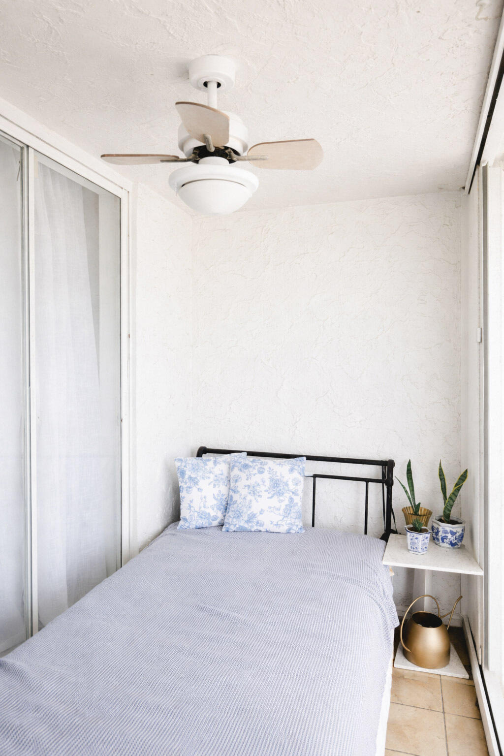 2403 Lowson Boulevard, Unit D Delray Beach, FL 33445 - Photo 18 of 21 a bedroom with a bed and ceiling fan