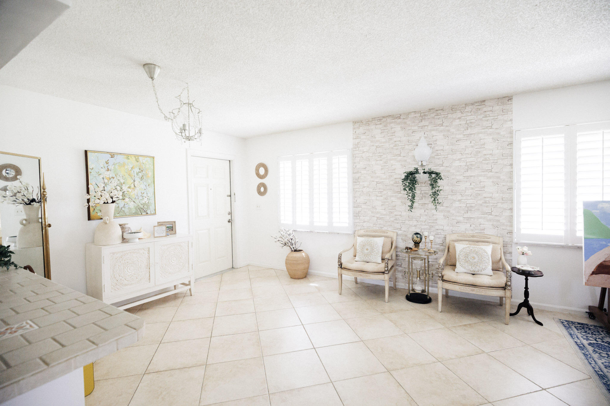 2403 Lowson Boulevard, Unit D Delray Beach, FL 33445 - Photo 5 of 21 a living room with furniture and a window