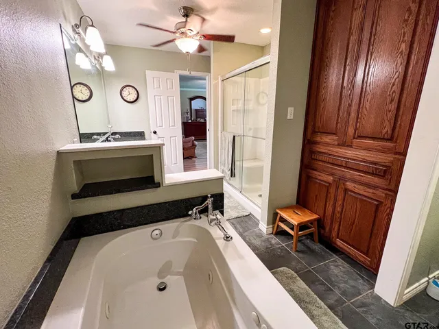 a bathroom with a sink a mirror and a toilet