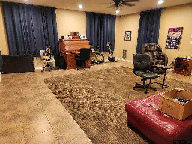 a work room with furniture and a window