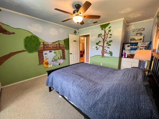 a bed room with a bed and a television