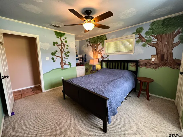 a bed room with a bed and a window