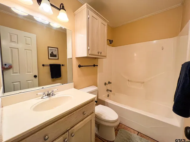 a bathroom with a sink a toilet and a bathtub