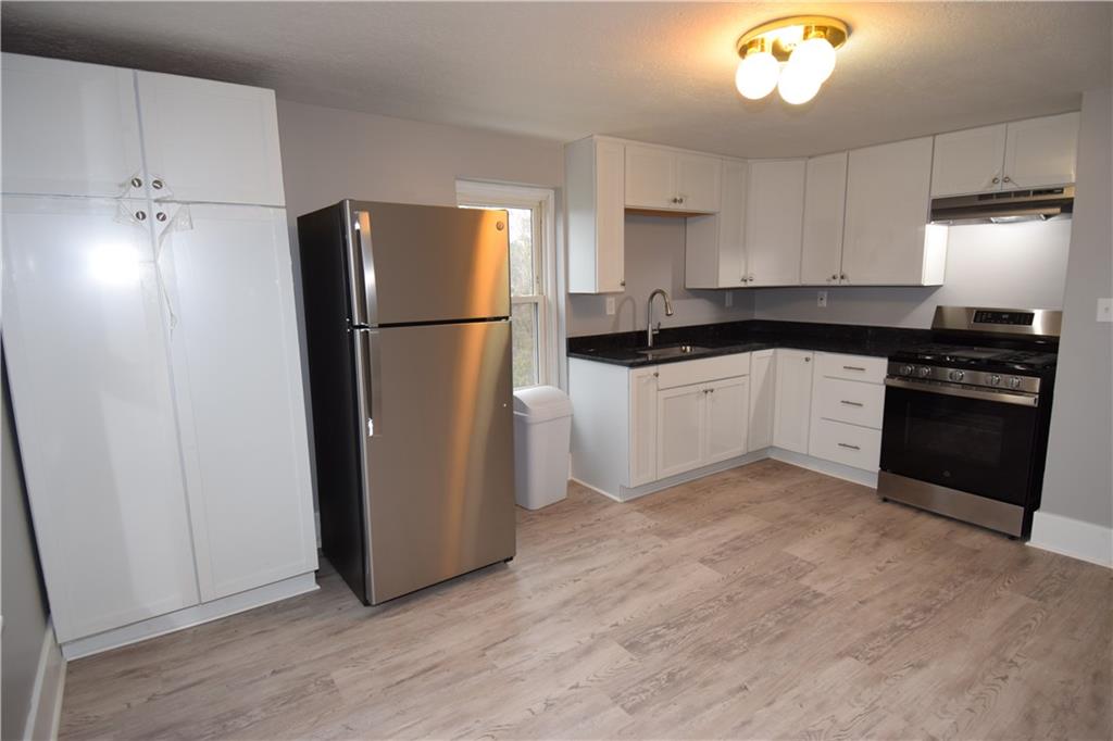 3224 Brodhead Road Aliquippa, PA 15001 - Photo 11 of 18 a kitchen with a refrigerator and a stove