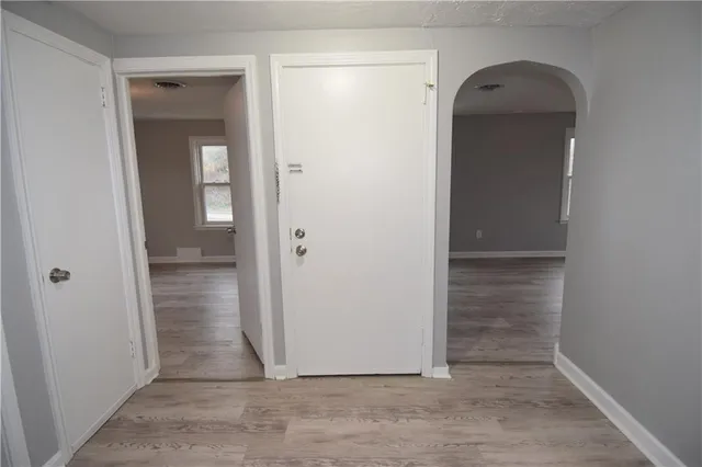 hallway view with wooden floor