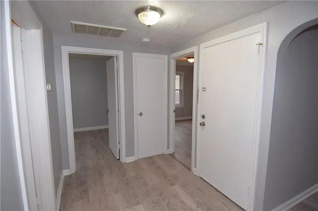 a view of hallway with closet area