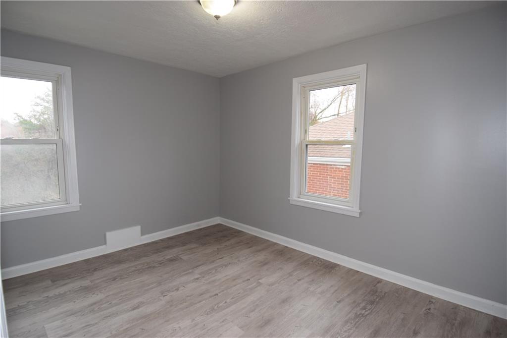 3224 Brodhead Road Aliquippa, PA 15001 - Photo 17 of 18 an empty room with wooden closet and windows