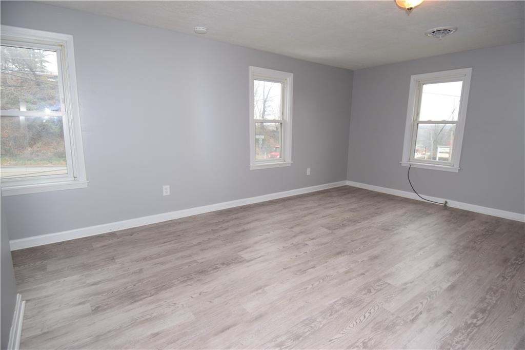 3224 Brodhead Road Aliquippa, PA 15001 - Photo 4 of 18 an empty room with wooden floor and windows