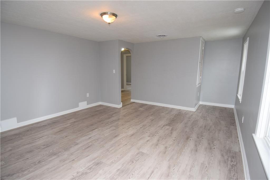 3224 Brodhead Road Aliquippa, PA 15001 - Photo 7 of 18 a view of an empty room with wooden floor