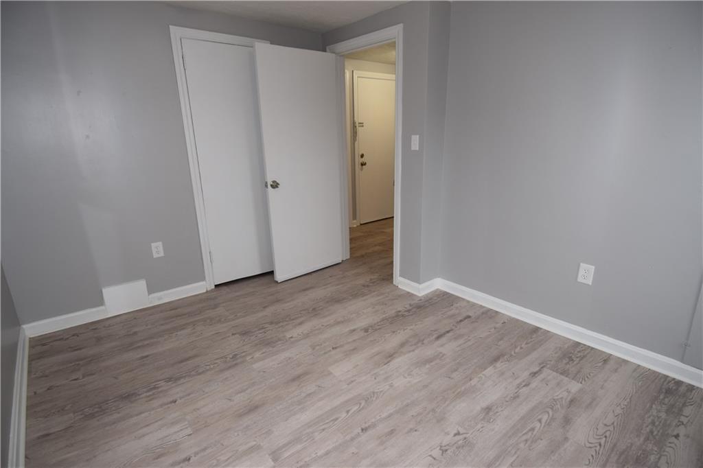 3224 Brodhead Road Aliquippa, PA 15001 - Photo 8 of 18 a view of an empty room with wooden floor