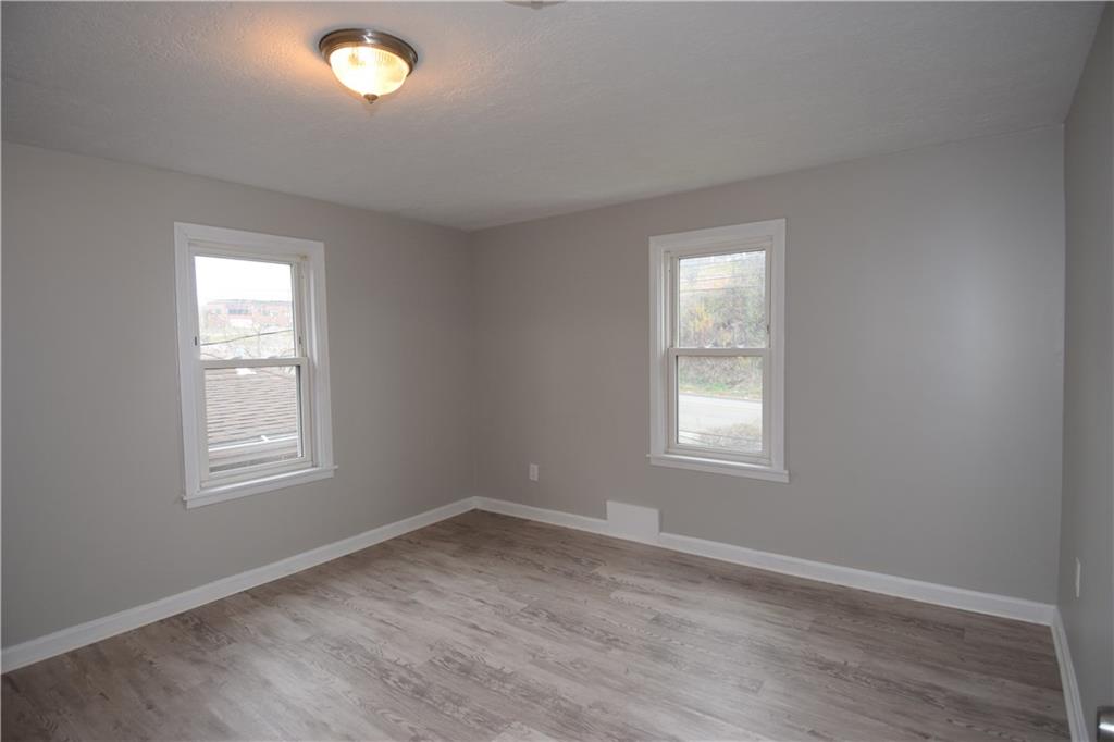 3224 Brodhead Road Aliquippa, PA 15001 - Photo 9 of 18 an empty room with wooden closet and windows
