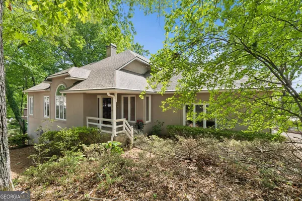 a front view of a house with garden